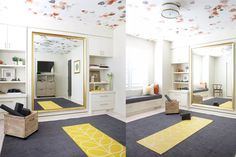 two pictures of a room with mirrors and yellow rugs