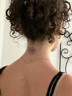 a woman with a tattoo on her back