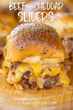 a cheeseburger on a plate with the words beef and cheddar sliders