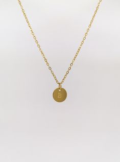 "This personalised coin charm necklace is perfect for everyday wear thanks to the smart PVD gold plating technology. This material keeps its gold colour for years and years PVD gold plated stainless steel - this material is suitable for everyday wear and even after touch with water /sweat it remains golden and shiny Meaningful gift for everyone! Choose one inital (letter) and I will stamp it on the disc pendant - as you can see on photos it is nice and sturdy coin  The chain width 1,5 mm = 1/16\ Minimalist Gold Stainless Steel Name Necklace, Gold Adjustable Round Disc Charm Necklaces, Minimalist Initial Round Disc Necklace For Personalized Gift, Gold Initial Necklace With Round Pendant For Everyday, Personalized Gold Coin Necklace In Minimalist Style, Minimalist Round Disc Initial Necklace As Gift, Minimalist Round Disc Initial Necklace As Personalized Gift, Minimalist Round Disc Initial Necklace For Gift, Minimalist Gold Monogram Charm Necklace