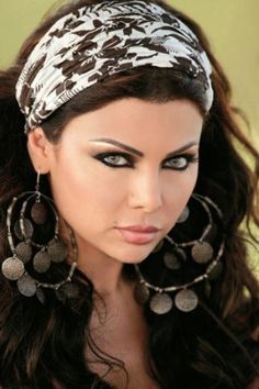 Haifa Wehbe- love the gypsy earings and makeup :) --Reference for King Rehema Hair Color 2017, Party Tricks, Arabic Women, Purim Costumes, Haifa Wehbe, Expressive Eyes, Arabian Beauty, Dramatic Makeup, Haifa