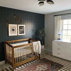 a baby's crib in the corner of a room