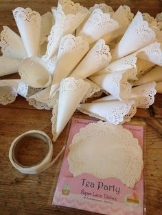 some white paper doily sitting on top of a wooden table