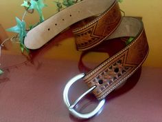 "This vintage handmade genuine leather belt has a classic tooled leather western country style, perfect to complete your cowgirl or cowboy outfit. It is made of high quality thick brown genuine leather with finished edges that enhanced the beauty. It's decorated in a tooled woven style pattern pattern. You can match it with your daily clothes or use it as part of a costume. - Ideal for Size Small (please see measurements below) - Stamped on the leather: \"KEN-228 Genuine Italian Leather Olga San Brown Leather Rodeo Belt, Brown Leather Belt For Rodeo, Brown Hand Tooled Belt Buckles For Rodeo, Hand Tooled Brown Belt Buckles For Rodeo, Rustic Brown Hand-tooled Belt, Rustic Brown Hand Tooled Belt, Hand-tooled Brown Belt Buckles For Western-themed Events, Western Brown Belt Buckles For Rodeo, Western Style Brown Belt For Rodeo