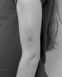 a woman with a small tattoo on her arm