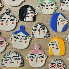 some very pretty decorated cookies with faces on them