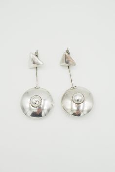 "Listing is for FUN VTG Sterling silver Modern Avant Garde Space Age Geometric pendulum earrings. Fun, light, geometric earrings with long dangle drop pendulum. Earrings measure 2.5\" end to end. Diameter is 1.1\". Weight is 12.6 grams. Tested positive for silver by acid & magnet testing. Earrings are not signed. There is a small dent on the middle part of one of the earring. Please, see close up picture.  Good vintage condition! Thank You. (D29)" Modern Silver Linear Drop Earrings, Modernist Silver Drop Earrings, Minimalist Silver Linear Earrings, Modern Silver Metal Linear Earrings, Modern Silver Linear Earrings, Modern Silver Linear Metal Earrings, Modern Metal Long Drop Linear Earrings, Silver Modernist Earrings, Modern Silver Linear Pierced Earrings