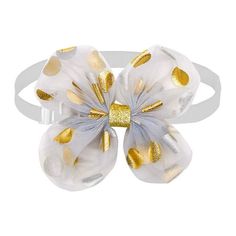 a white and gold hair bow with two large bows on it's headband