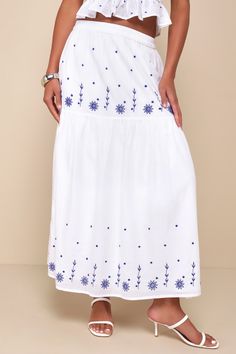 With your favorite sandals and the Lulus Summery Aura White Embroidered Tiered High-Waisted Maxi Skirt, your warm weather looks will always be adorable! Lightweight woven fabric shapes this breezy skirt that has a high, elasticized waist and a tiered design, with blue floral embroidered details throughout. Maxi hem completes the look. Pair with the matching top for a complete look! Fit: This garment fits true to size. Length: Ankle length. Size medium measures 36.5" from waist to hem. Waist: Fit Summer Long Embroidered Skirt, Summer Embroidered Long Skirt, Embroidered Long Skirt For Summer, Summer Long Skirt With Embroidered Hem, Summer Festival Skirt With Floral Embroidery, Summer Floral Embroidery Tiered Skirt, Casual Summer Skirt With Embroidered Hem, Summer Beach Skirt With Floral Embroidery, Summer Skirt With Embroidered Hem