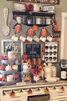 the coffee bar is decorated for fall with pumpkins and other things to eat on it