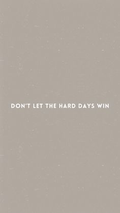 the words don't let the hard days win are written in white on a gray background