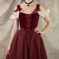 Our dark red velvet corset is the ultimate statement piece for those seeking a blend of luxurious elegance and historical charm. Perfect for renaissance faire costumes, Christmas parties, gothic or vampire outfits, or simply adding a bold, regal touch to your wardrobe, this corset is designed to flatter your silhouette while offering comfort and durability. Crafted from rich, 100% cotton deep red velvet, this corset features a classic lace-up front and back lacing for an adjustable fit, and synt Velvet Corset Dress For Costume Party, Fitted Medieval Dress For Theater, Red Vintage Costume Corset, Red Vintage Corset For Costume, Vintage Red Corset For Costume, Red Fitted Medieval Costume Dress, Fitted Gothic Costume For Medieval Festivals, Fitted Red Medieval Dress Costume, Elegant Red Corset Dress For Costume