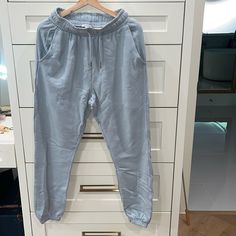 Brand New 100 % Cotton Light Blue Tapered Leg Pants With Pockets, Light Blue Straight Casual Pants, Casual Blue Ankle-length Bottoms, Casual Ankle-length Blue Bottoms, Casual Blue Ankle-length Pants, Casual Light Blue Trousers, Light Blue Casual Trousers, Blue Relaxed Fit Ankle-length Jeans, Trendy Blue Straight Leg Sweatpants