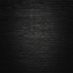 a black brick wall with no one in it