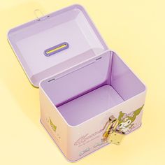 a pink and purple lunch box on a yellow background