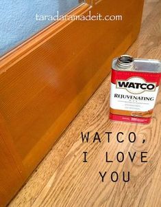 a can of paint sitting on top of a wooden floor next to a door with the words watco i love you