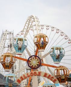 an amusement park with ferris wheel and rides