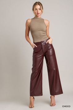 These pants are the epitome of chic and edgy style, crafted from high-quality faux leather that adds a touch of sophistication to any outfit. The straight leg design offers a timeless and flattering silhouette, making these pants a versatile choice for various occasions. Brown Faux Leather Pant Pairings, Luxury Leather Pants With Five Pockets For Women, Luxury Leather Straight Leg Pants With Five Pockets, Luxury Leather Straight Pants With Pockets, Luxury High-waist Leather Pants With Pockets, Luxury Fitted Leather Pants With Pockets, Luxury Leather Trousers For Workwear, Luxury Belted Wide Leg Pants For Fall, Elegant Luxury Leather Pants With Pockets