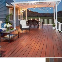 a deck with chairs, table and lights on it