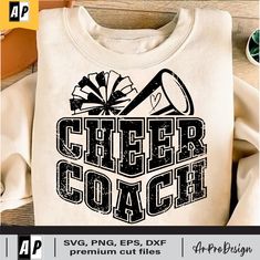 a t - shirt that says cheer coach with a megaphone on the front and side