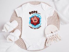 Oops... I Crit My Pants Baby Bodysuit, D&D Themed Newborn Outfit, Funny Gaming Dice Baby Suit, RPG Inspired Baby Gift Welcome your little adventurer with this whimsical "Oops... I Crit My Pants" baby bodysuit, perfect for families who love gaming and tabletop role-playing. This playful suit features a 20-sided die graphic, making it an ideal choice for parents who are Dungeons & Dragons fans and want to share their passion with their newest family member. Unique Design: Show off your love for RP Announcement Outfit, Unique Bodysuit, Dice Design, Gaming Dice, Funny Gaming, Adventure Baby, Making Life Easier, Dungeons Dragons, Pregnancy Reveal