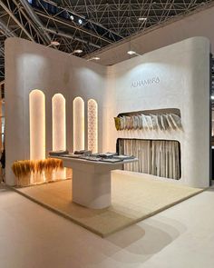 the interior of a showroom with white walls and carpeted flooring on display