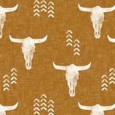 a pattern with longhorns and arrows on a tan background that is very similar to the cow skull