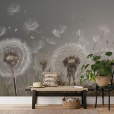 a room with a bench, plant and wallpaper on the walls that has dandelions blowing in the wind