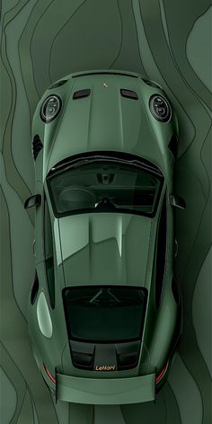 the top view of a green sports car in front of a wavy wallpaper background