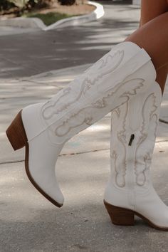 Tall white western cowboy boot. Features a tan embroidered detail. Material: Vegan leather. This style runs true to size! Lauren Nicole, Heel Accessories, Outfit Wedding Guest, All White Outfit, Sweater Tank Top, Shoe Gifts, Cowboy Boot, Western Cowboy Boots, Boots And Sneakers