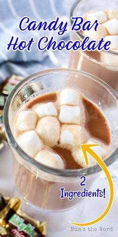 two glasses filled with hot chocolate and marshmallows