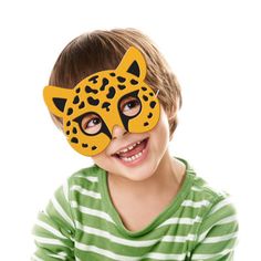 a young boy wearing a yellow mask with a leopard print on it's face