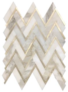 a white and gold herringle tile pattern