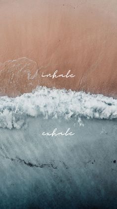 an aerial view of the ocean with words written in white ink on top of it