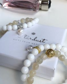 ✰ Luxury white moonstone bracelet with 14k gold filled lion head is a treasure. It has a very pure feminine energy and provides calmness to its wearer. Lovely gift that comes in a premium gift box by Stardust! The bracelet ahs beautiful blue sparkles and features one clear crystal bead to amplify the energy flow! Wearings moonstone jewelry: ♥ Boosts inner growth and strength. ♥ Brings feminine energy n higher level. ♥ Attracts abundance in life. ♥ Soothes emotional instability and stress, and st Elegant Natural Stones Beaded Bracelet, Luxury White Beaded Bracelets, Elegant Moonstone Beaded Bracelets As Gift, Elegant Moonstone Beaded Bracelet As Gift, Handmade White Bracelet As Gift For Her, Luxury Gemstone Beaded Bracelets As Gift, White Gemstone Beads Bracelet As Gift, Elegant Moonstone Crystal Bracelet For Gift, Gold Agate Crystal Bracelet Gift