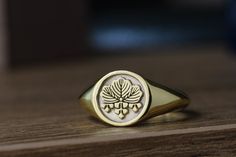 "custom family crest signet rings delicately engraved with your family crest or any other initials or image you want ♡ the ring has solid back. deep and detailed engraving very delicately handcrafted unisex - looks super cool on both women & men side or inside engravings cost 12 USD for both sides. please contact us if you request side engravins or simply go back to our shop and purchase the \"Side or inside engraving fee\" listing. available in 4 round face sizes: small - 12x12 mm medium - Signet Ring Men Family Crest, Family Signet Ring, Custom Class Rings, Mens Gold Signet Rings, Wax Seal Ring, Class Rings College, Family Crest Rings, Custom Signet Ring, Gold Initial Ring