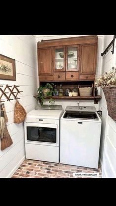 a white stove top oven sitting inside of a kitchen next to a washer and dryer