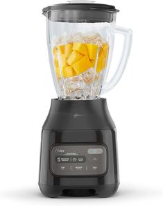 a blender filled with fruit and ice