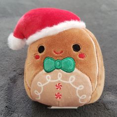 a stuffed animal with a santa hat on it's head