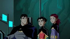 batman and his friends are standing in the elevator