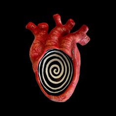 an image of a human heart with spirals on it's side and black background