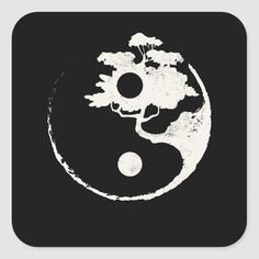 a black and white yin symbol with trees