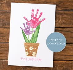 a card with handprinted flowers in a pot