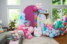 a living room filled with lots of balloons