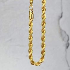 Boss up and cop a solid and genuine gold piece with a bold look! Solid gold rope chains are super flexible. Due to the intricate wiring, micro spaces allow for the rope to be flexible but not too dense. The size is perfect for smaller pendants and everyday wear. SPECIFICATIONS: Material: 18K Solid Gold Width: 5MM Length: 18 Inches or 24 Inches Comes with a box & certification Note: Solid gold chains are special order items and ships in approximately 7-10 days after ordering. Hip Hop Bling, Gold Rope Chains, Solid Gold Chains, Super Flexible, Hip Hop Outfits, Gold Piece, Small Pendant, Buying Jewelry, Rope Chain