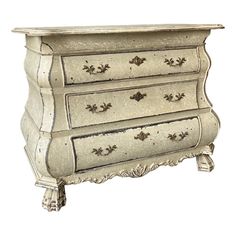 a white dresser with ornate carvings on the top and bottom drawers, painted in silver