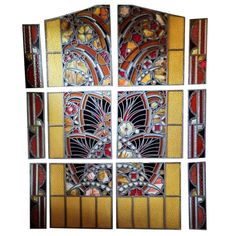 four stained glass panels with different designs on them