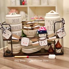 a table topped with lots of white dishes