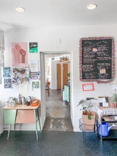 the inside of a room with various items on the wall and pictures on the wall