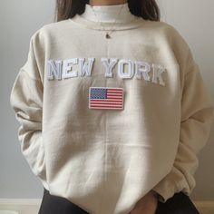 This very comfy and trendy New York sweatshirt is perfect for lounging in this cozy fall and winter season! This is also perfect for gifting to your loved ones! Please note that the letters are patches and are heat pressed, NOT embroidered. Purchasing this means you are aware and accept that. Our sweatshirts run in a UNISEX fit. The sweaters naturally have a slightly oversized fit giving extra room for moving around and comfort! For this reason, we highly recommend getting your true normal size Oversized Beige Letter Print Sweater, Oversized Beige Sweater With Letter Print, Beige Cotton Sweater With Letter Print, Casual Cream Cozy Fit Sweatshirt, Relaxed Fit Cream Sweater With Letter Print, Trendy Beige Sweatshirt Relaxed Fit, Beige Relaxed Fit Trendy Sweatshirt, Trendy Cream Sweatshirt With Relaxed Fit, Trendy Beige Relaxed Fit Sweatshirt